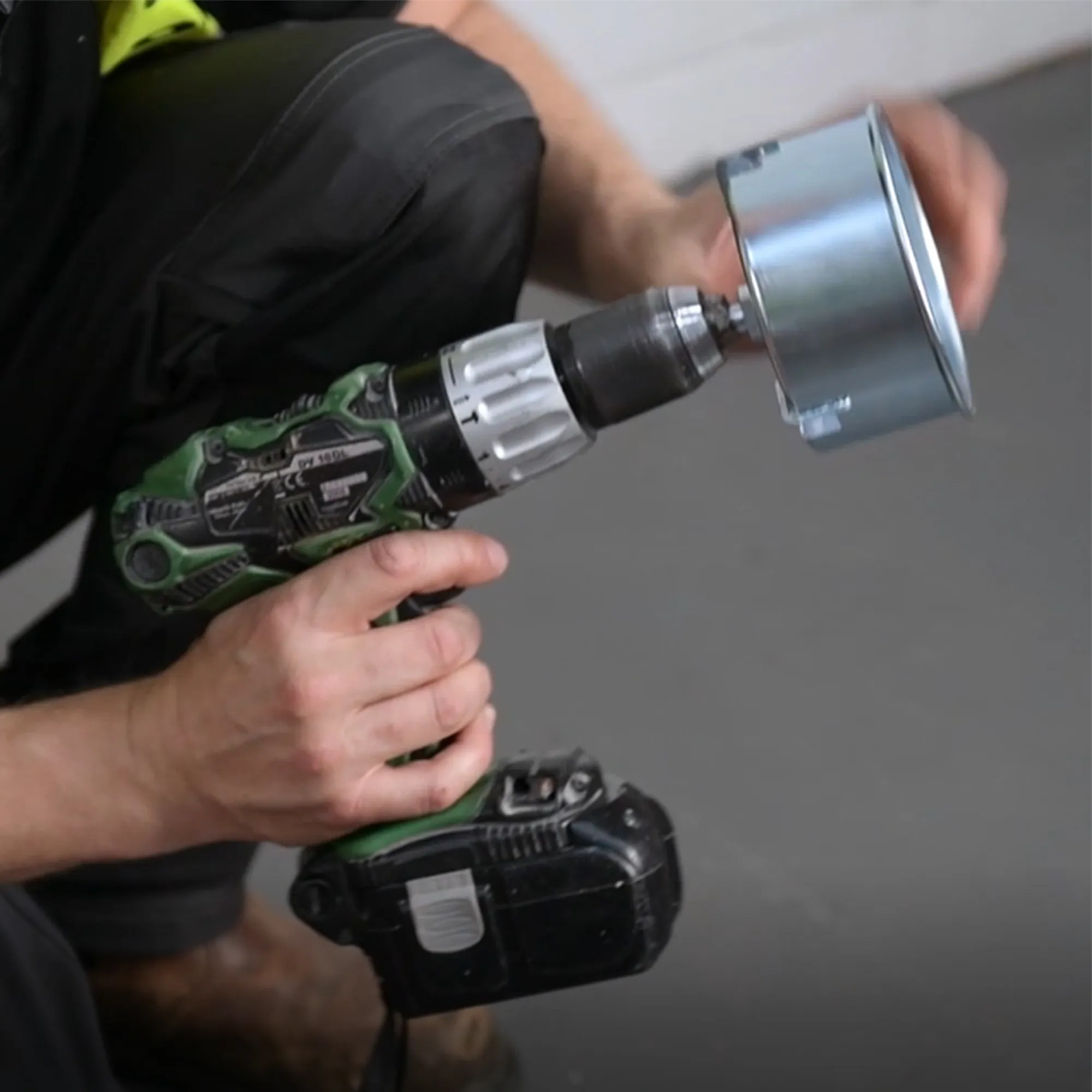 Metex CMF110 Chamf drainage pipe chamfering tool shown mounted on a power drill held by human hands