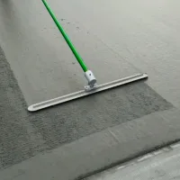 Fresno trowel without broom in use on a concrete slab